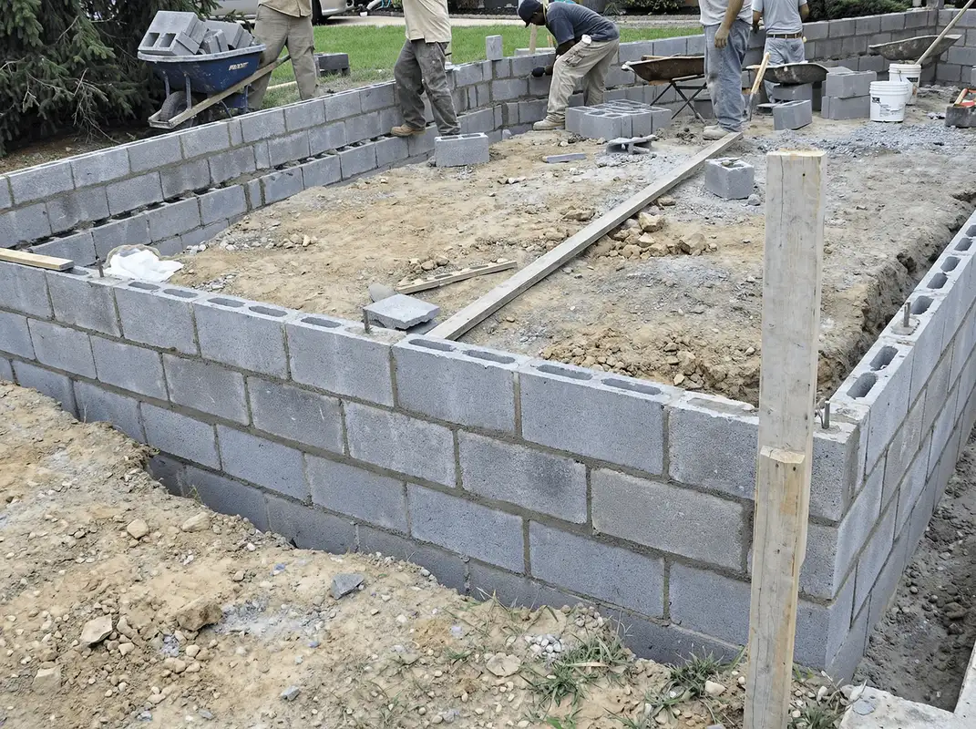 Professionals building a foundation with blocks in Jersey City, NJ