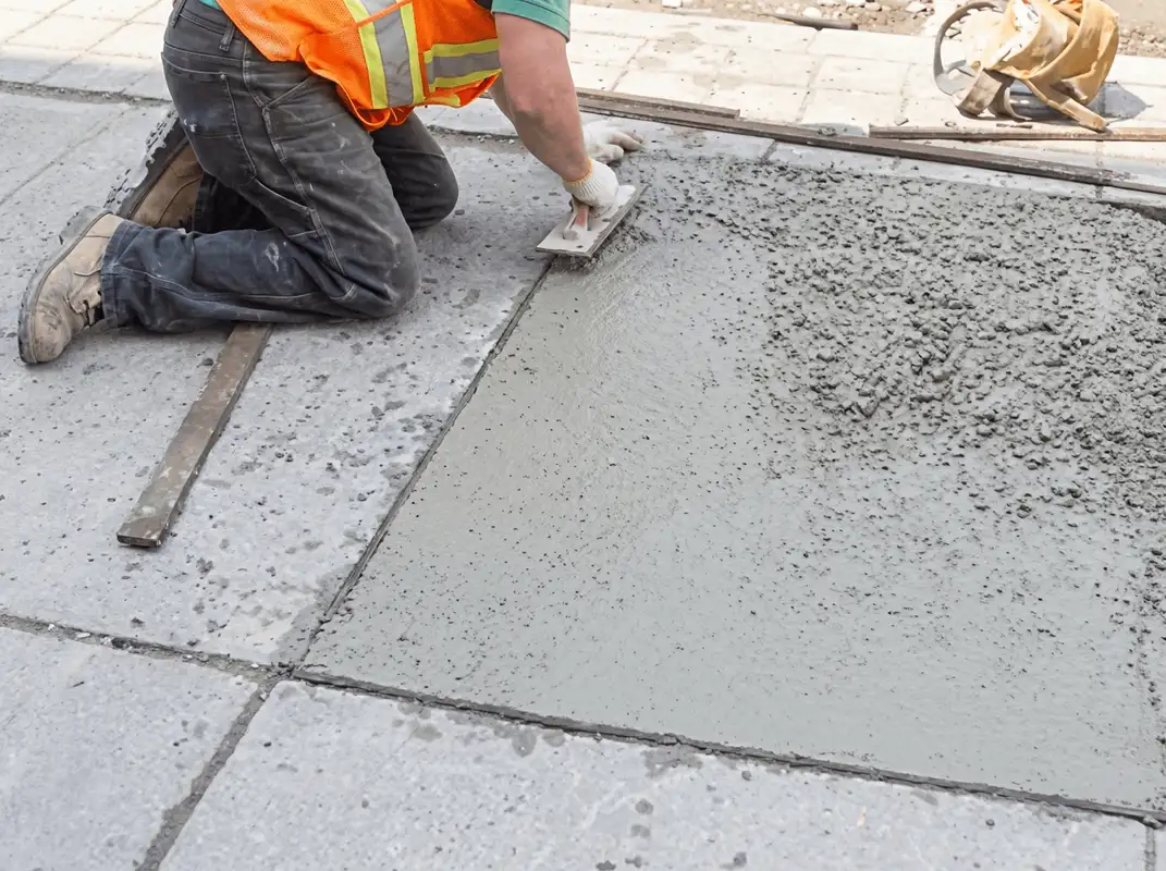 Professional repairing a concrete floor in Jersey City, NJ