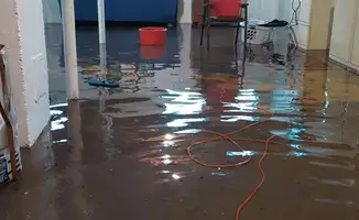 Basement with boiler, cabinets and washing machine completely flooded in Jersey City, NJ